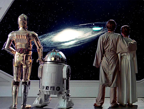 R2D2, C3PO, Luke y Leia observando el exterior de la nave